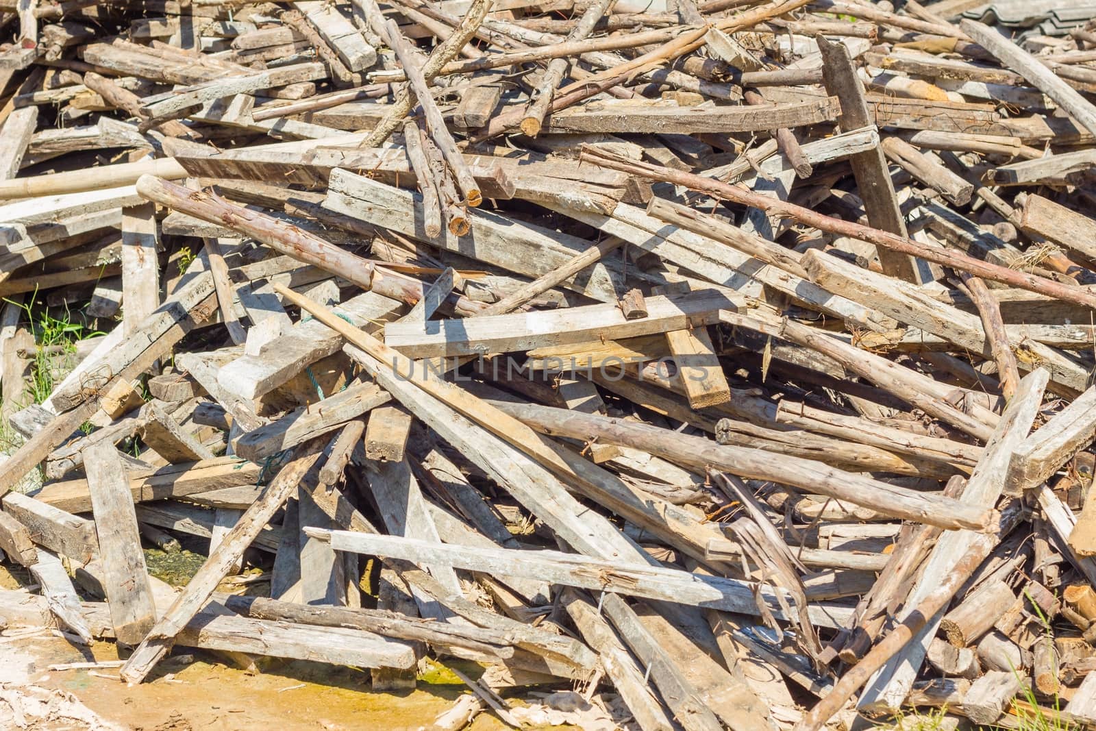 Waste wood pile abandon on the ground.