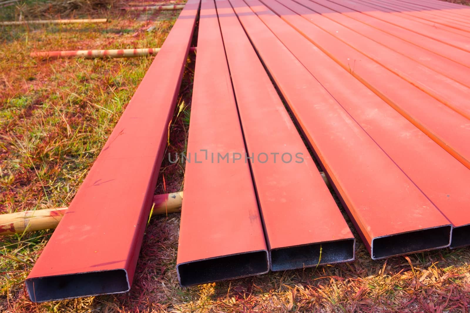steelworks sprayed in red with spray gun on the ground  by a3701027