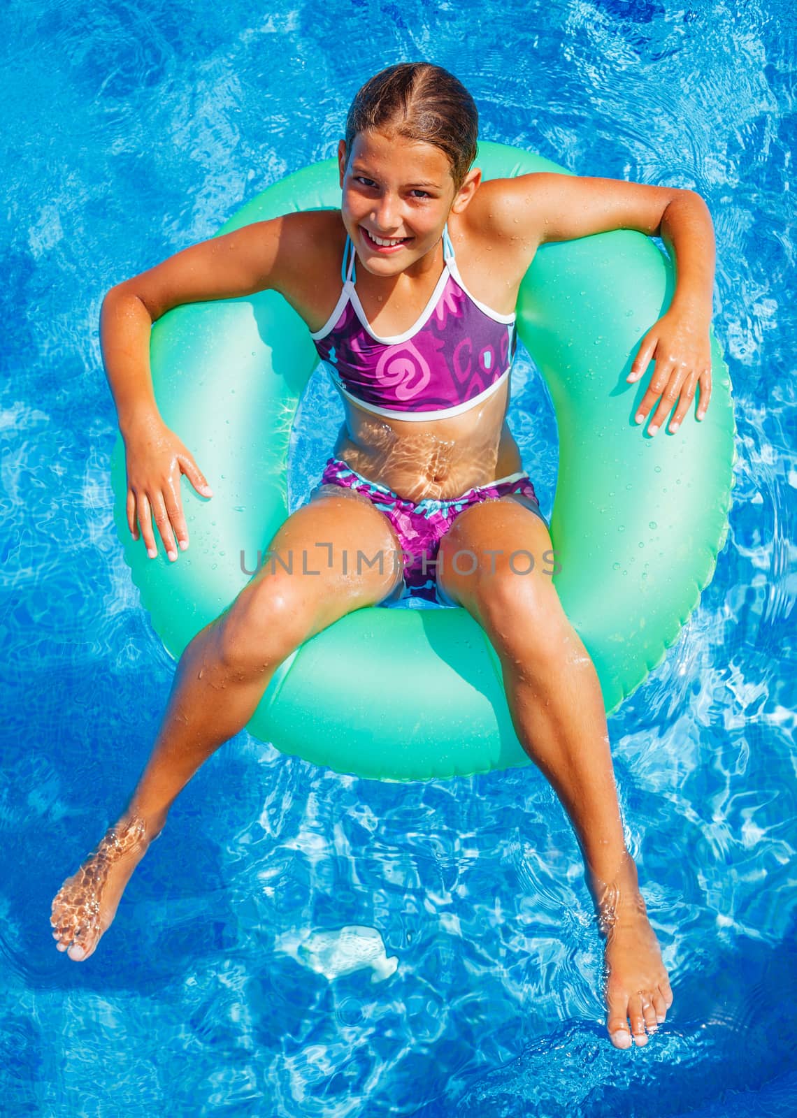 Girl swims in a pool by maxoliki