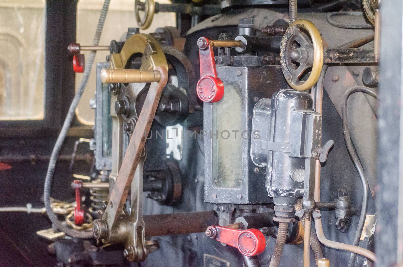 View into the cab of an old steam locomotive.