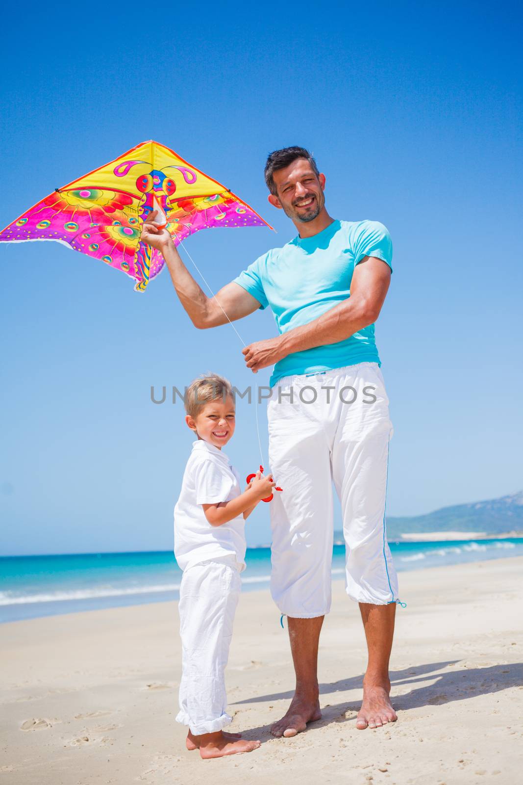 Boy and his father with kite. by maxoliki