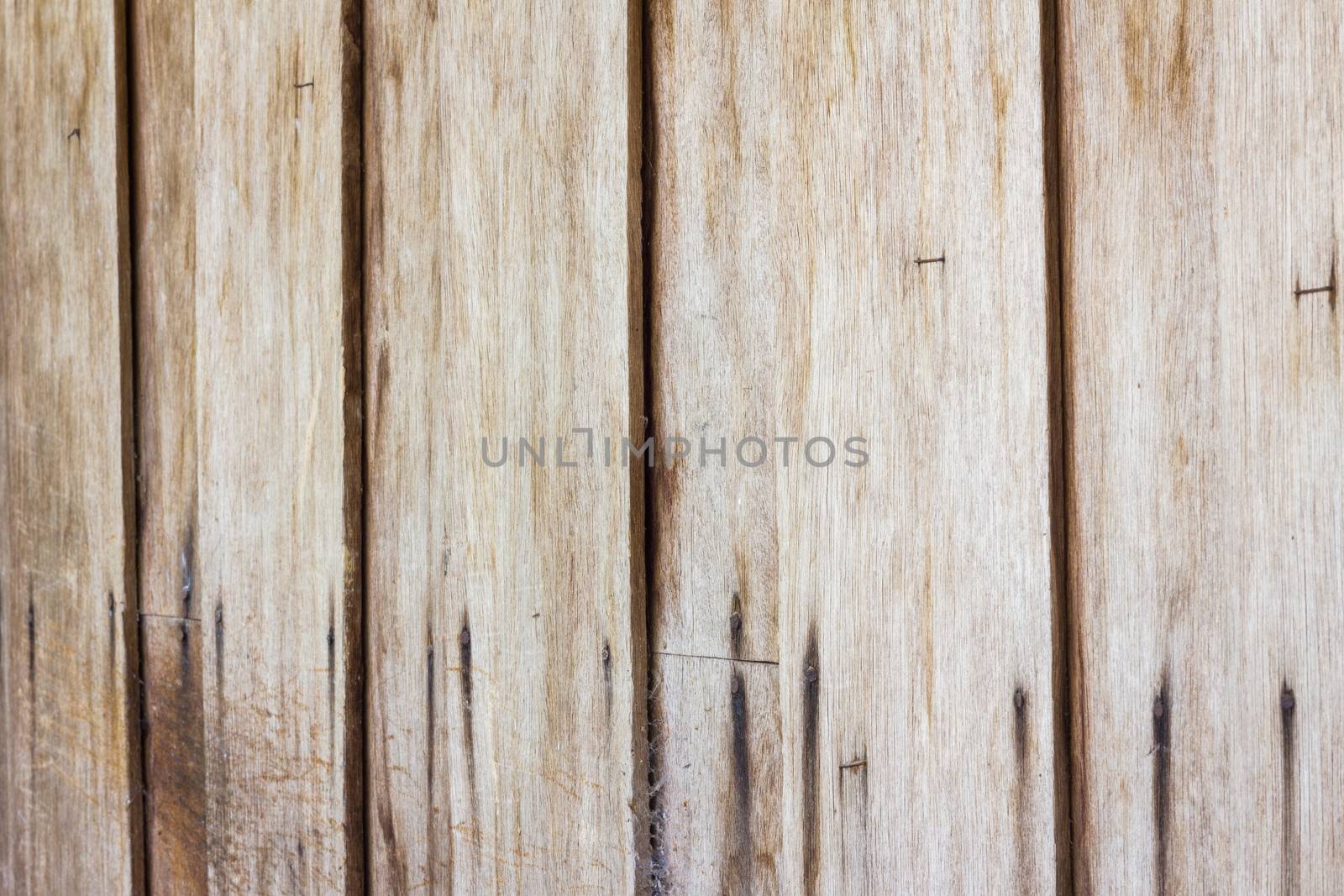 Close up of gray wooden fence panels, perspective by a3701027