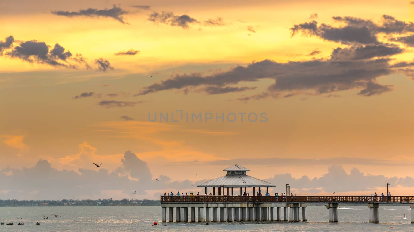 Fort Myers, Florida - Sept 1: People anxiously wait to see the beautiful sun set over the Atlantic Ocean at Fort Myers Beach, Florida, September 1, 2014