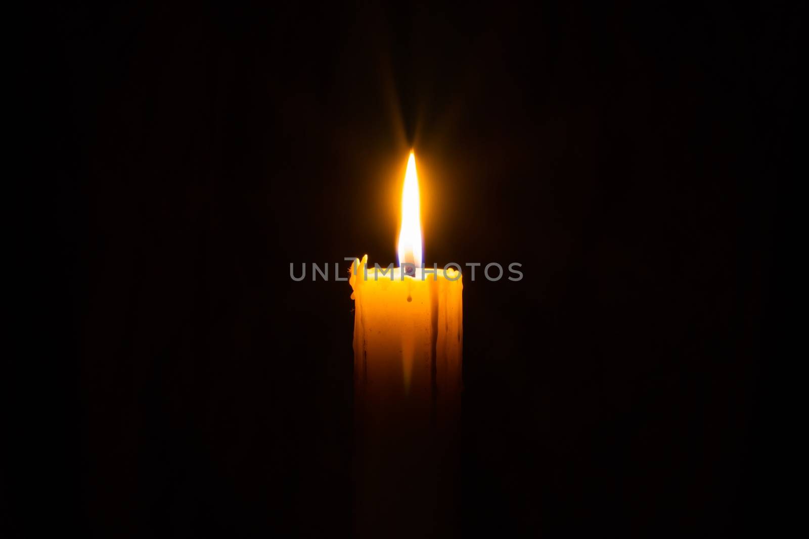 Candle in the darkness with copyspce