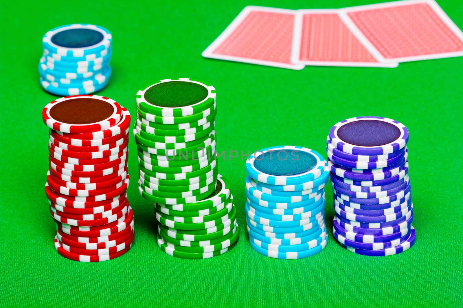 chips on the background of green the table. Cards in the backgro by pzRomashka