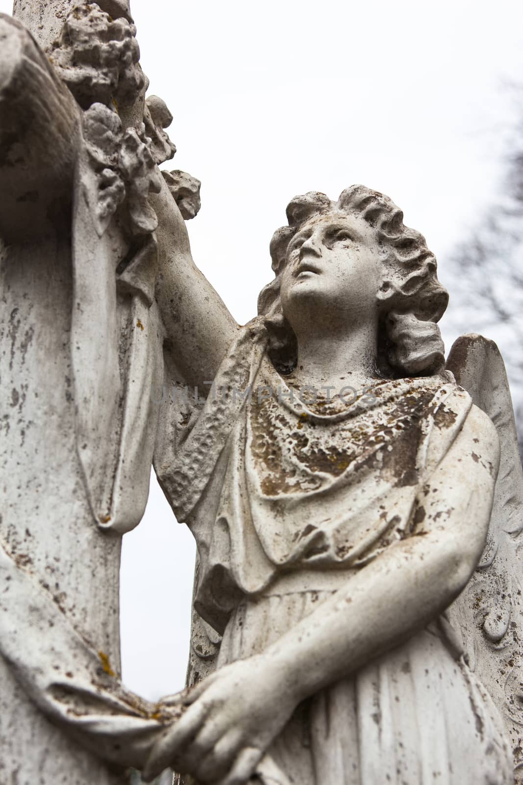 Old cemetery marble sculpture of the angel.