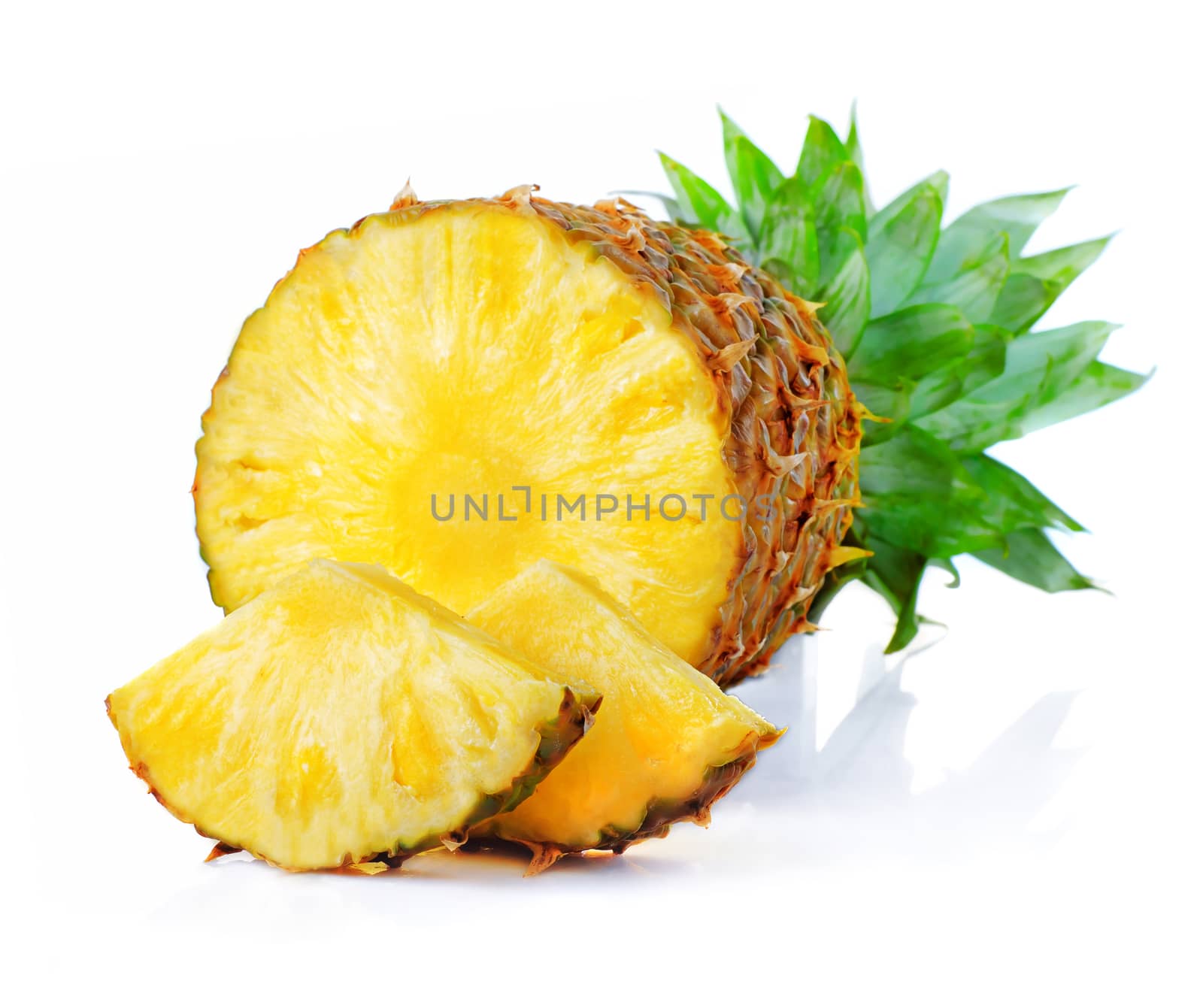 Fresh pineapple fruits with cut and green leaves isolated on whi by alphacell