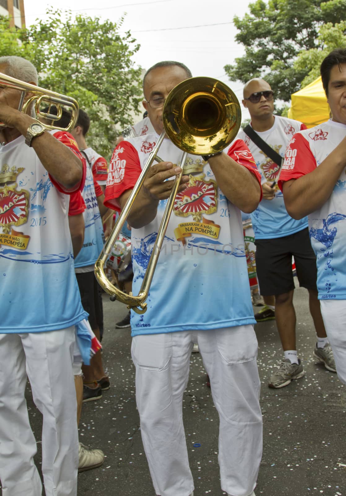 SAO PAULO, BRAZIL - JANUARY 31, 2015: An unidentified man playing trumpet in a traditional samba band participate in the annual Brazilian street carnival.