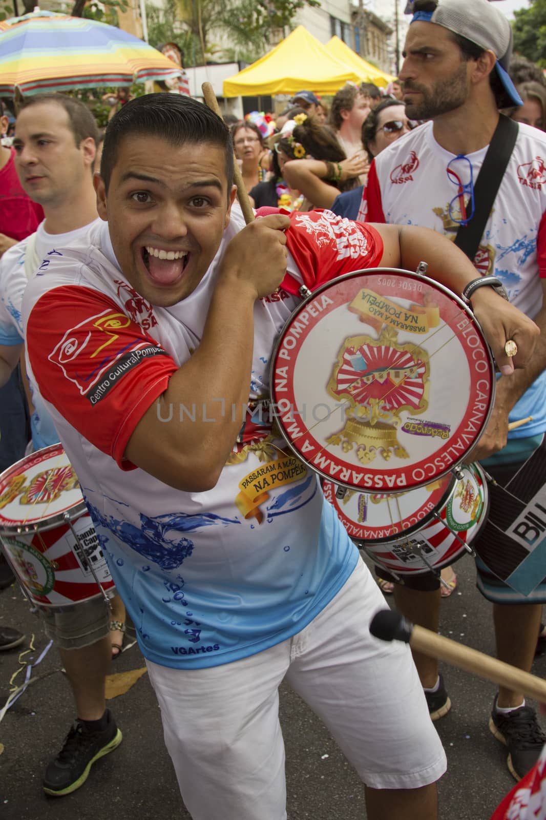 SAO PAULO, BRAZIL - JANUARY 31, 2015: An unidentified man playing drum in a traditional samba band participate at the annual Brazilian street carnival.