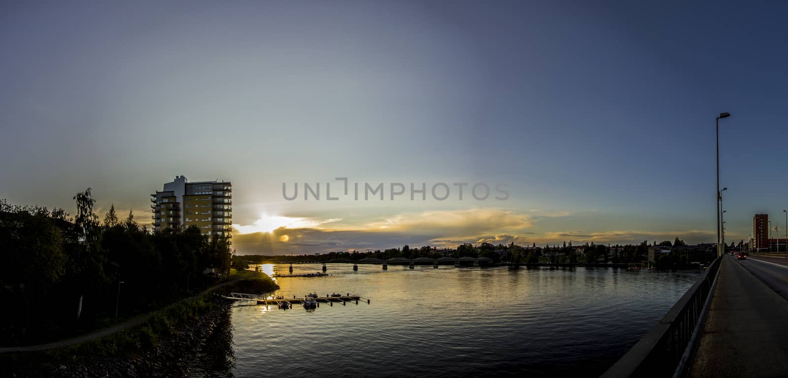 Sunset over River in City
