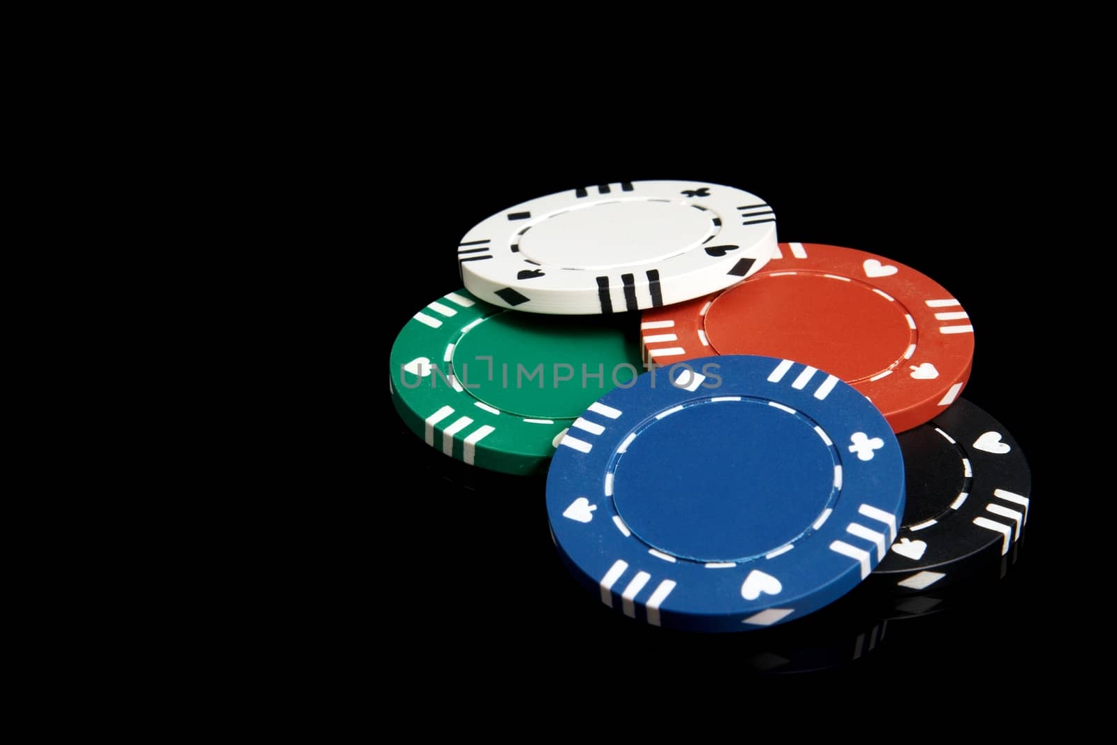 Set of poker chips on a black background