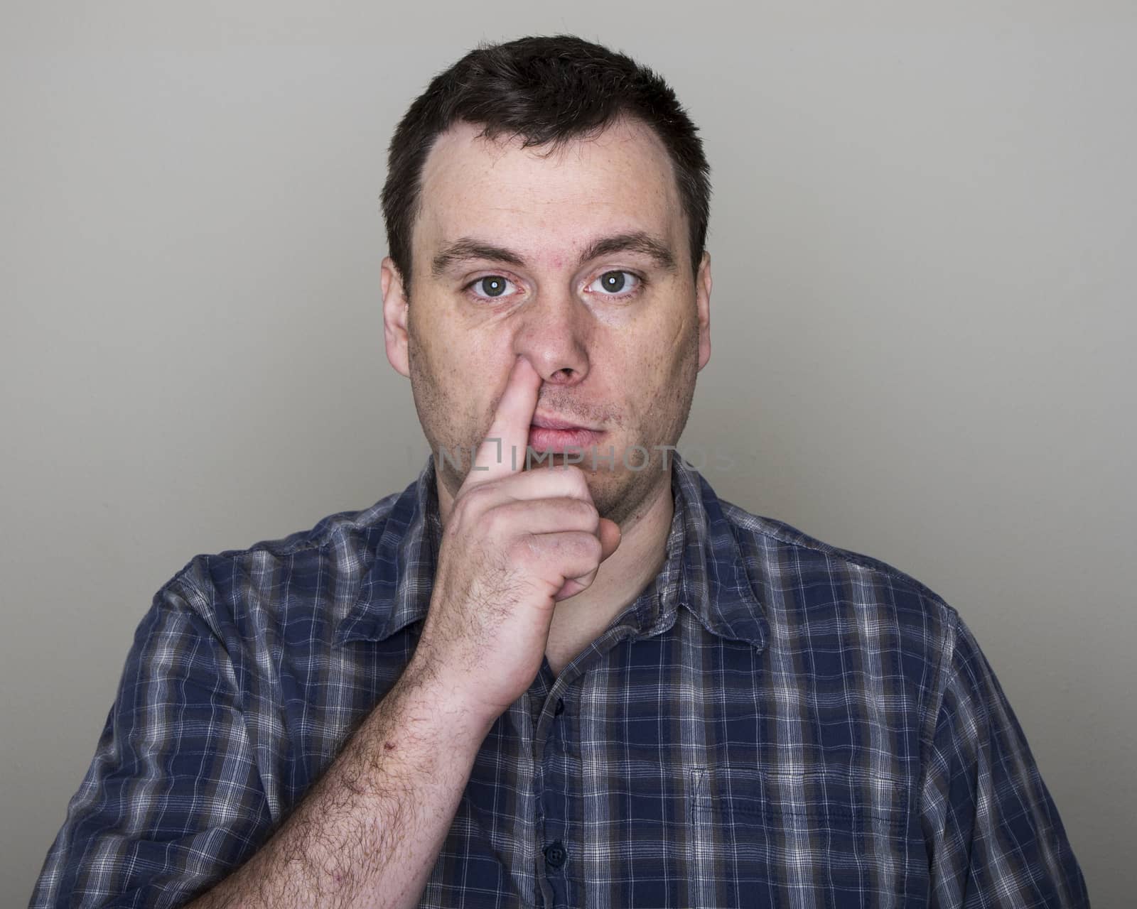 Picking a nose this guy can spread a disease this way.