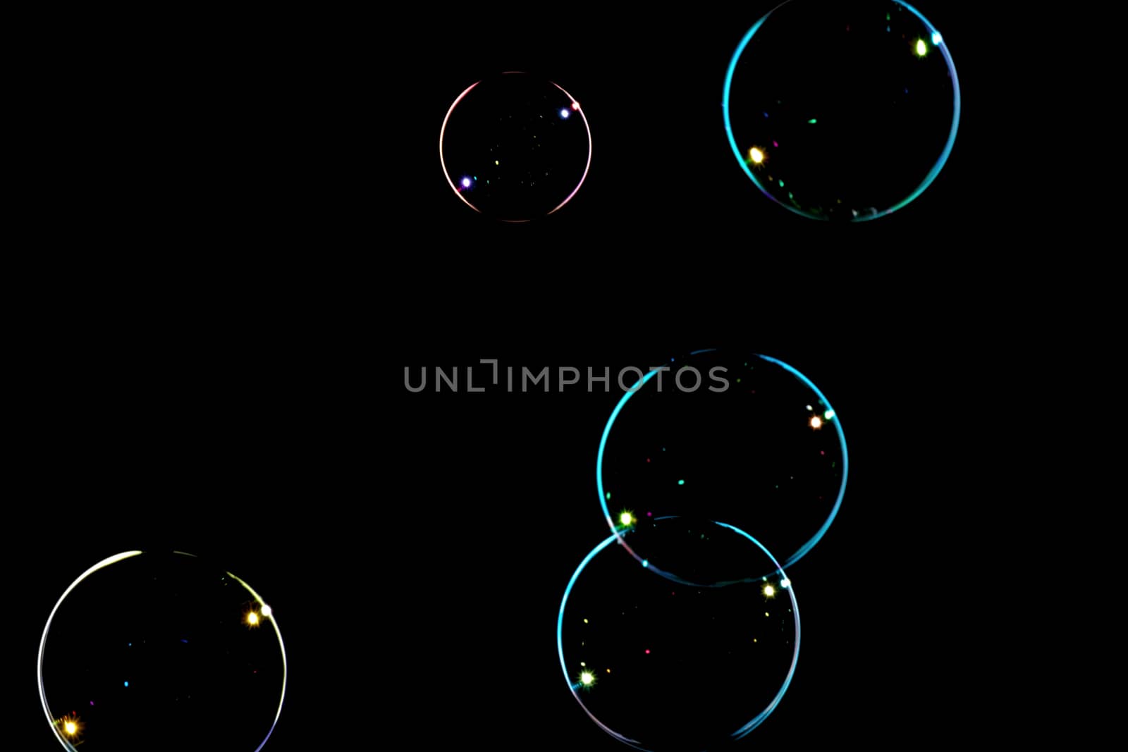 Group of soap bubbles on a black background