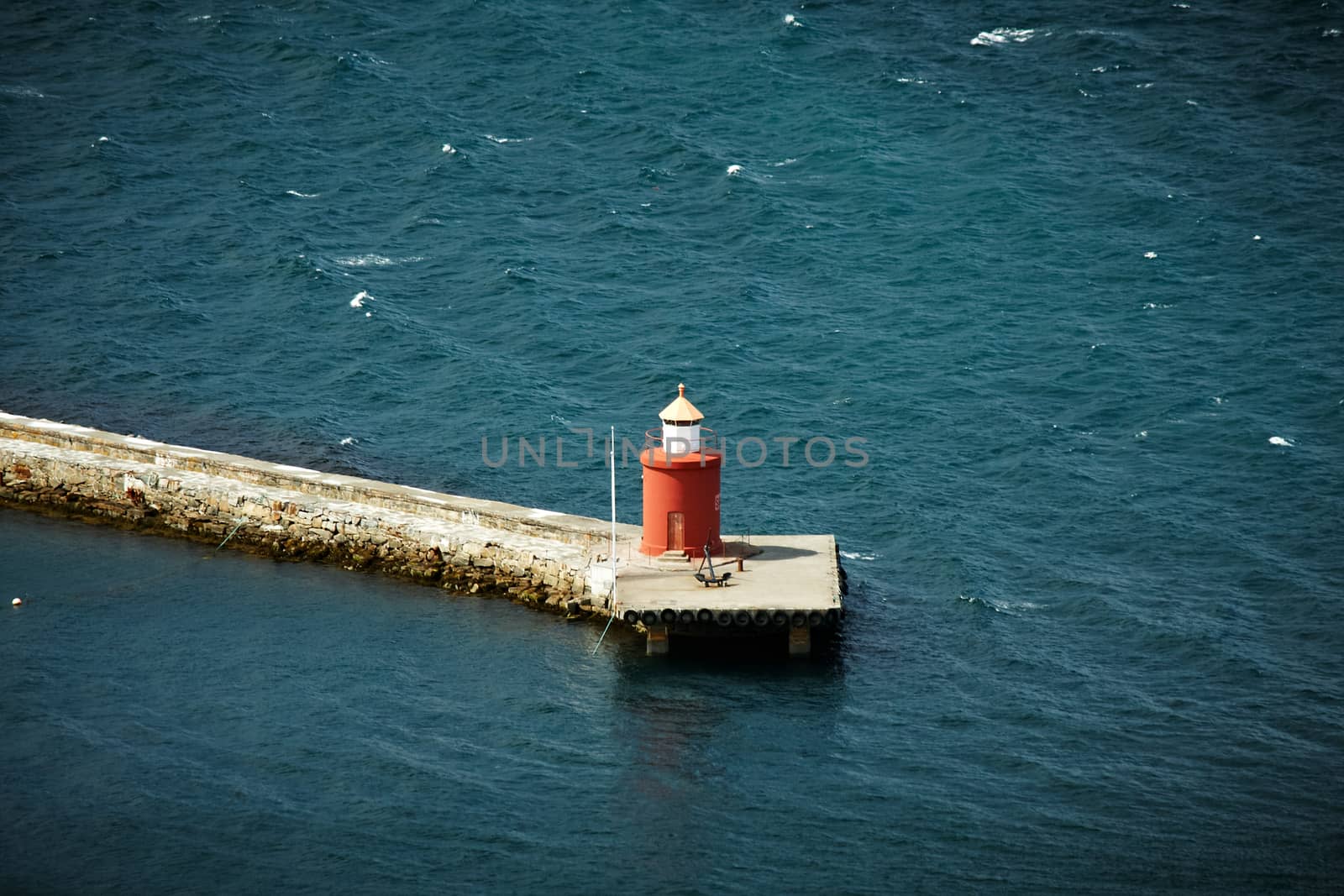 Lone red lighthouse in Alesund from the top