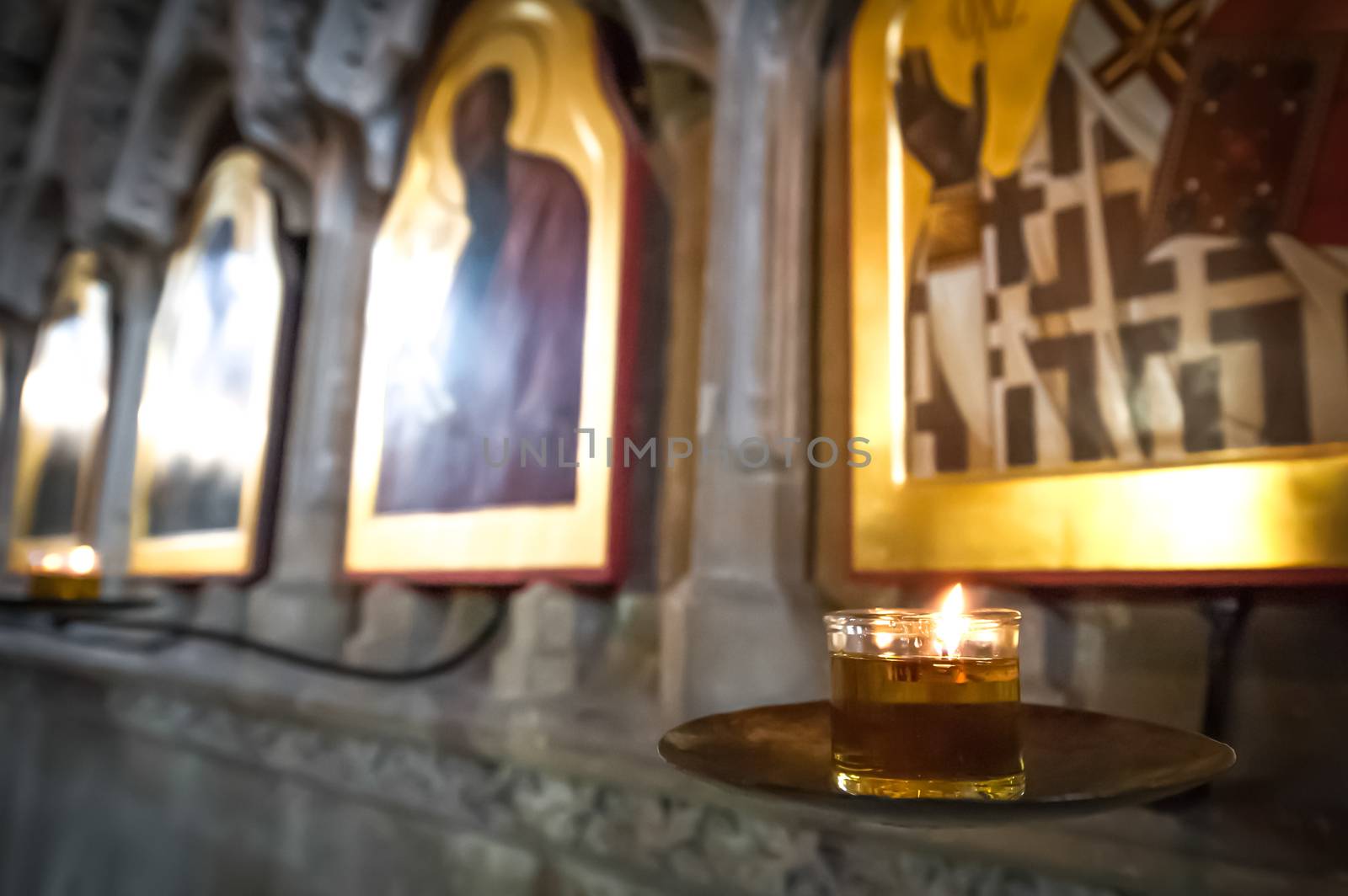 religious icons and candle by nelsonart