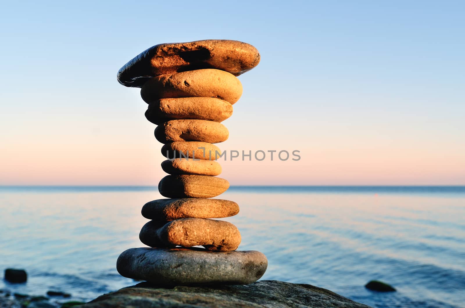 Balancing of stones each other on the seashore