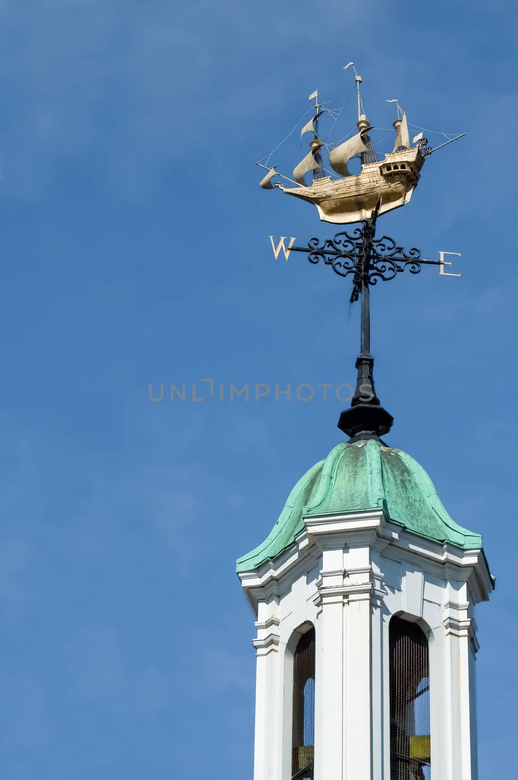 ornate weather vane on top of a bell tower