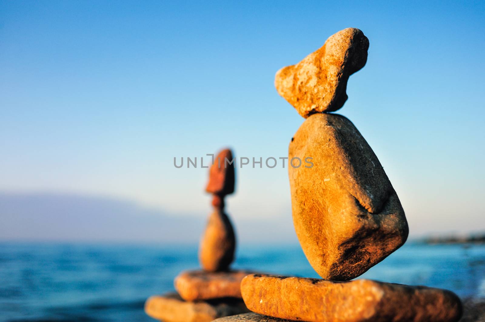 Balancing of stones each other on the seashore