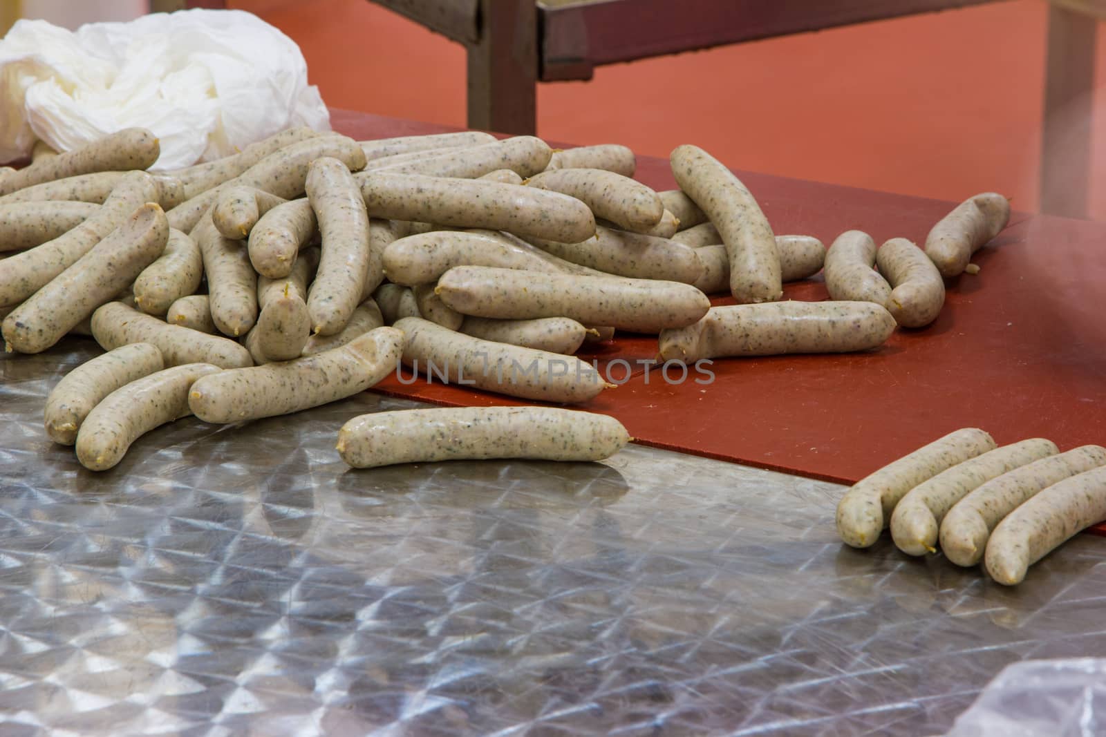 Meat sausages being made in a factory
