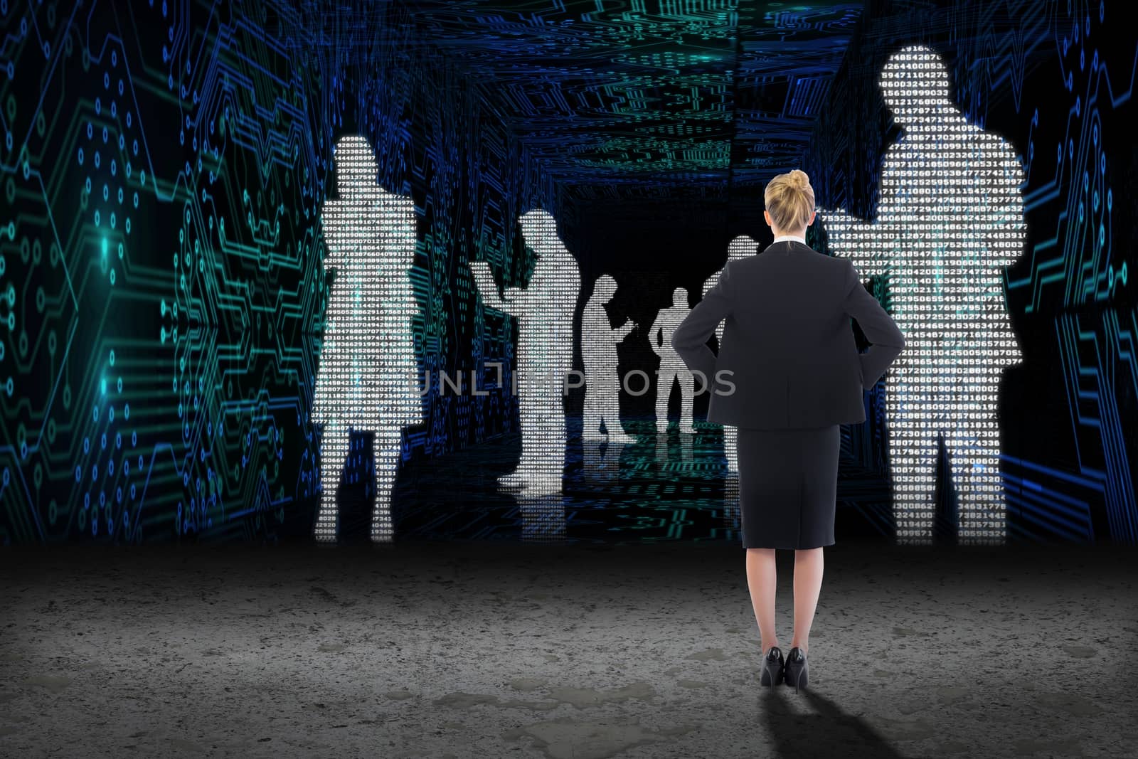 Composite image of businesswoman standing with hands on hips by Wavebreakmedia