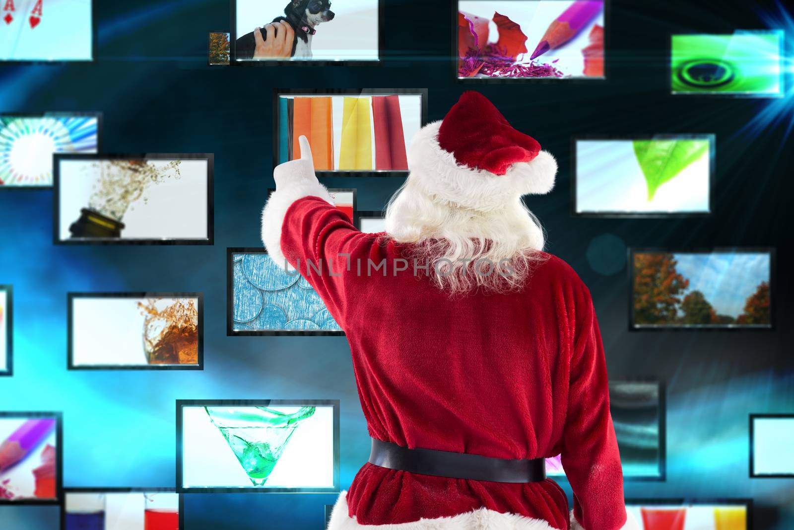 Composite image of santa claus points at something by Wavebreakmedia