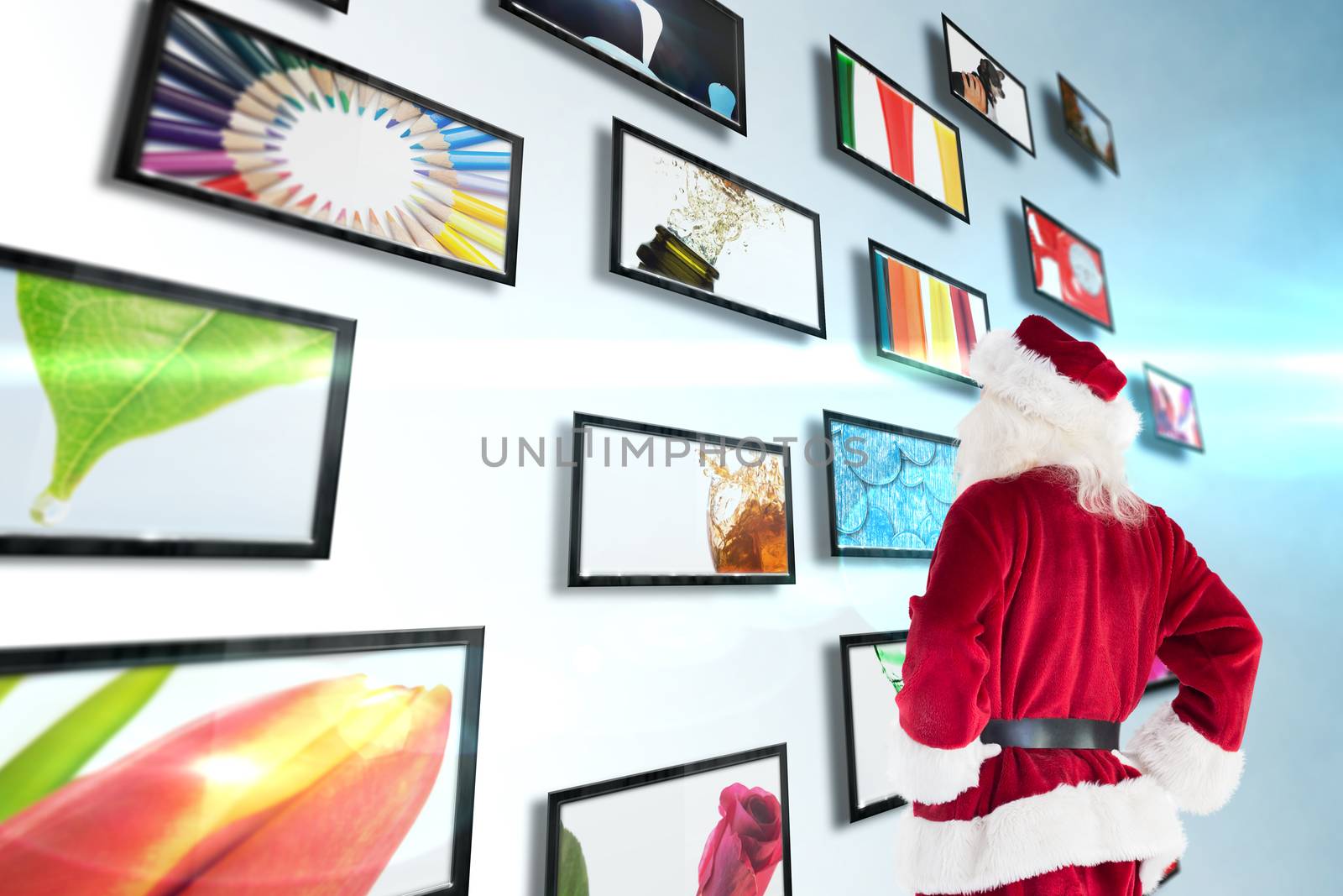 Composite image of santa looks away from the camera by Wavebreakmedia