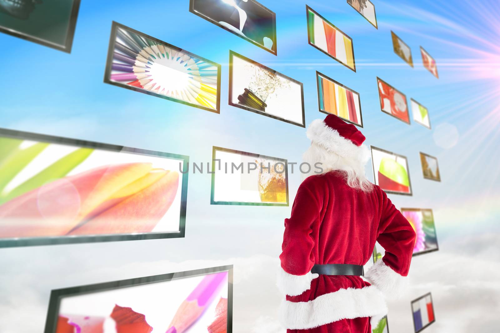 Santa looks away from the camera against screen collage showing lifestyle images