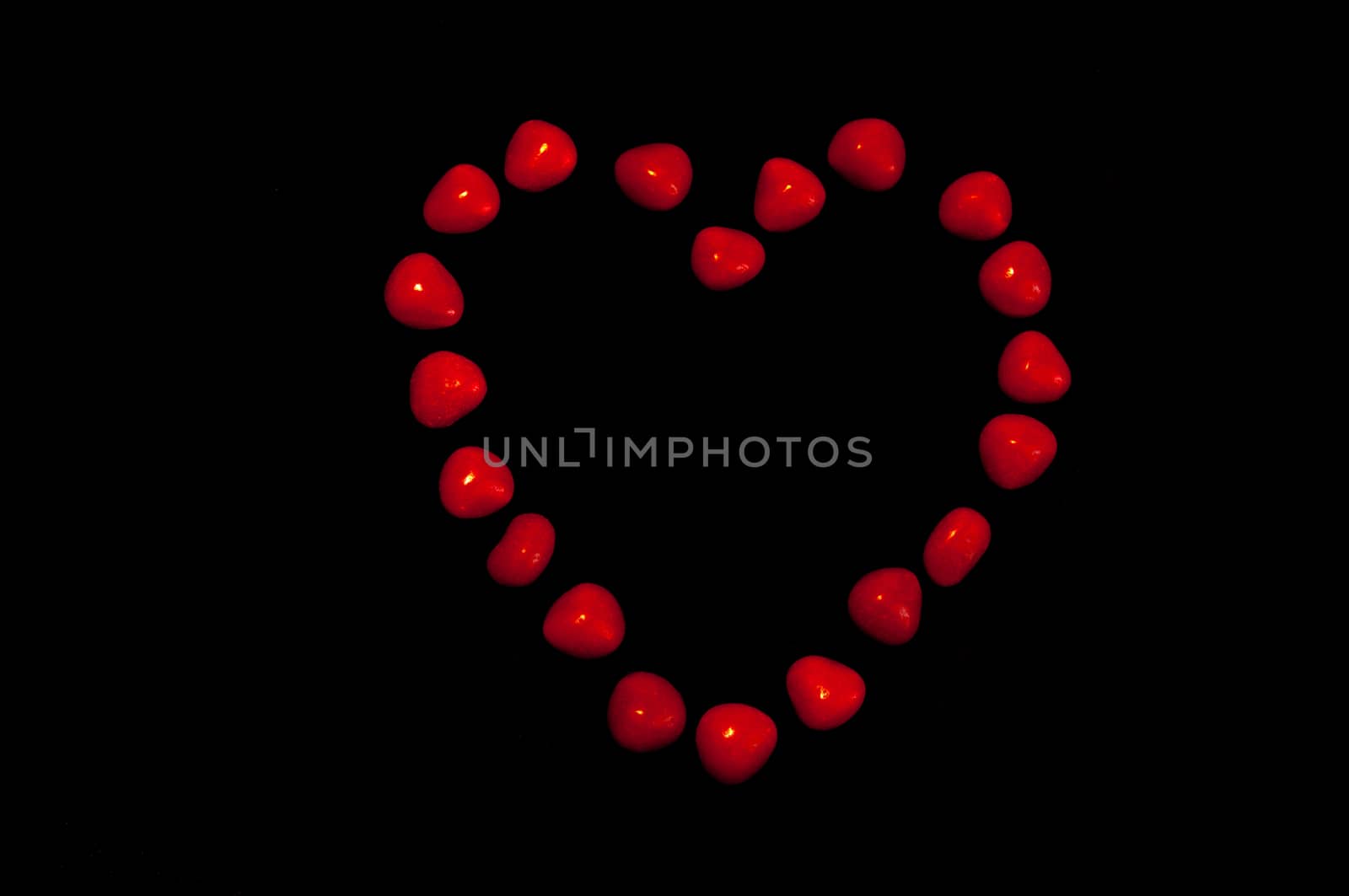 A red heart made of candy pieces