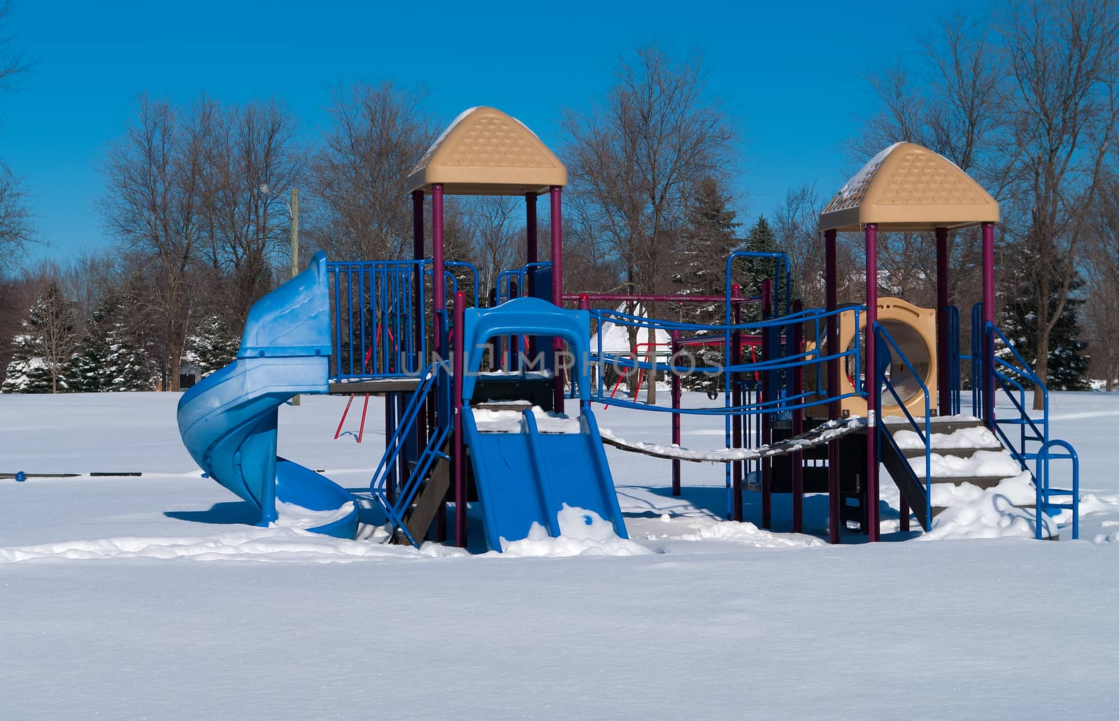 Park with playground equipment in the winter