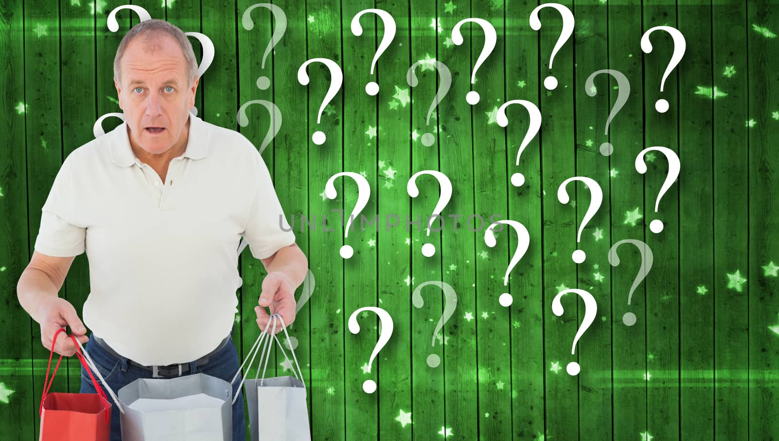 Shocked man holding shopping bags against star pattern on green planks