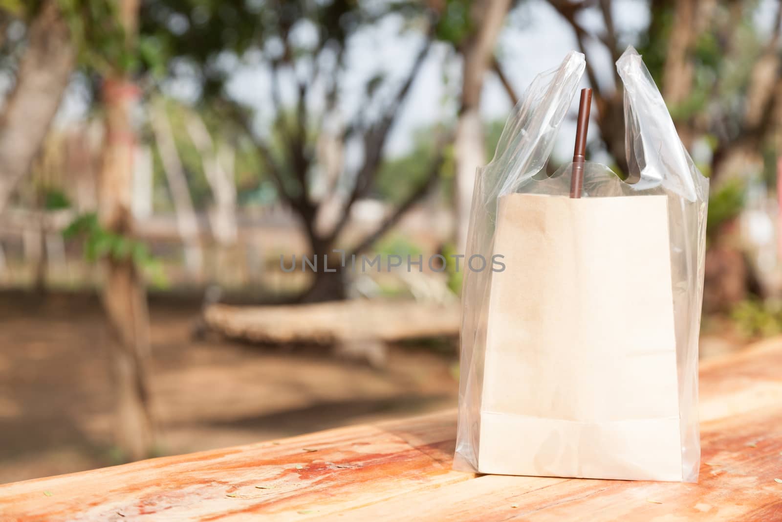 Brown paper bag. Put a plastic bag on the table.