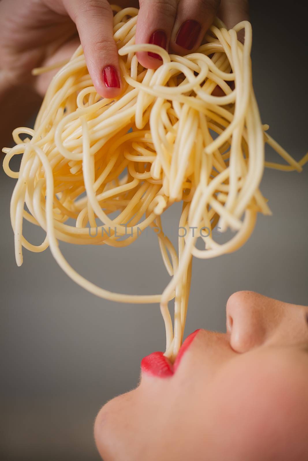 attractive woman with eating spaghetti. Concept idea 