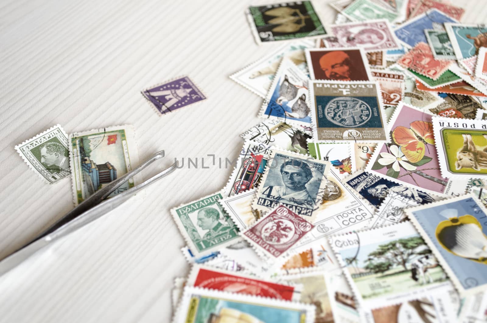 Backdrop of old worldwide postage stamps .