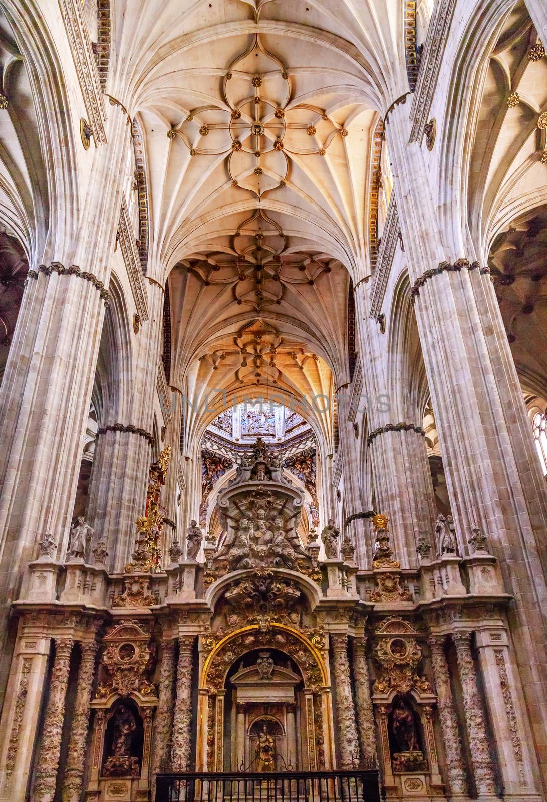 Stone Columns Angels and Mary Statues New Salamanca Cathedral Spain.  The New and Old Cathedrals in Salamanca are right next to each other.  New Cathedral was built from 1513 to 1733 and commissioned by Ferdinand V of Castile, Spain.