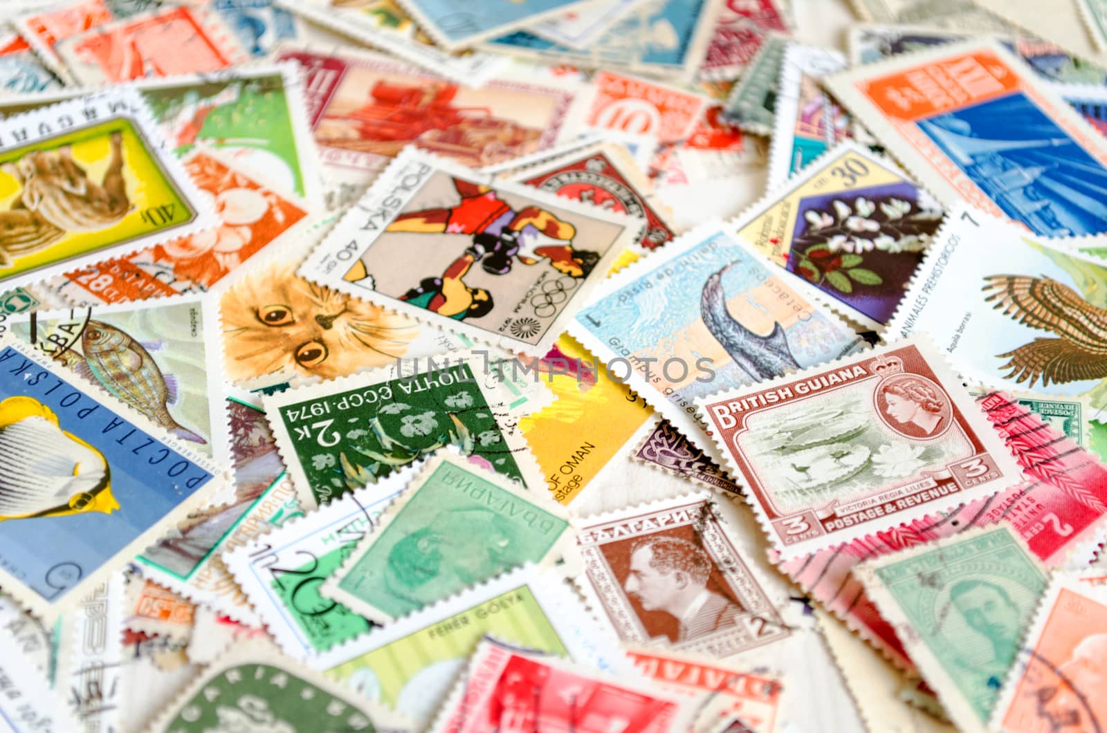 Backdrop of old worldwide postage stamps .
