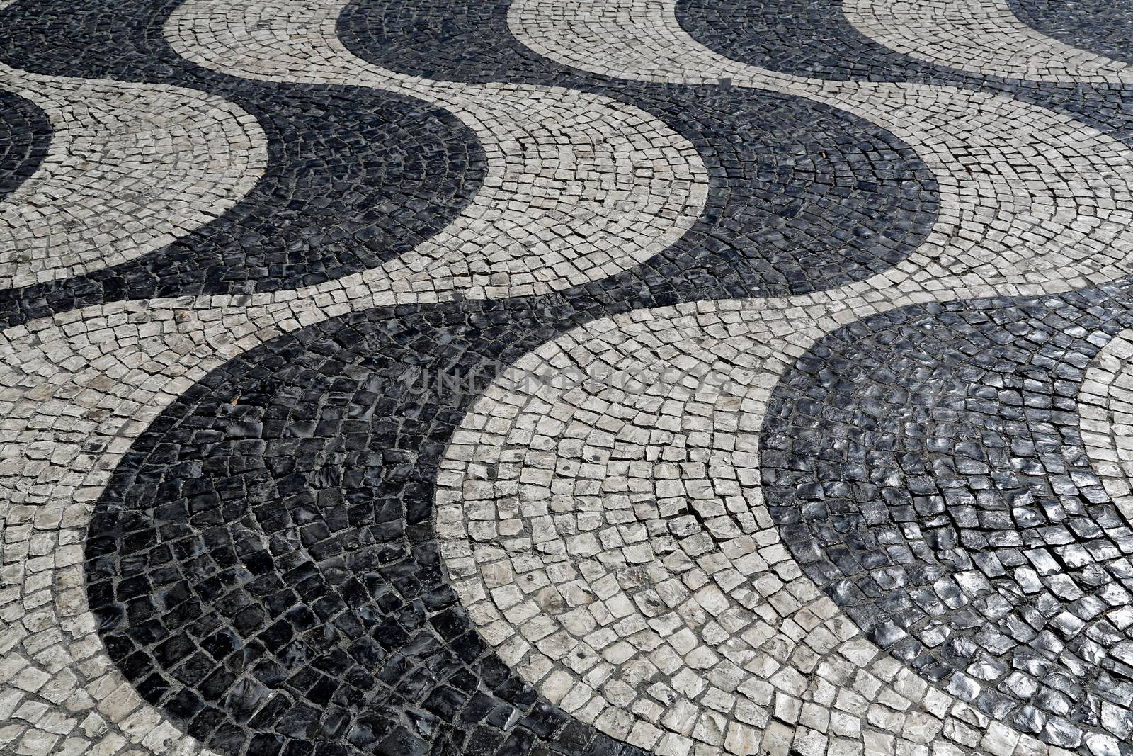 Typical waves of tiled floor in portuguese traditional style