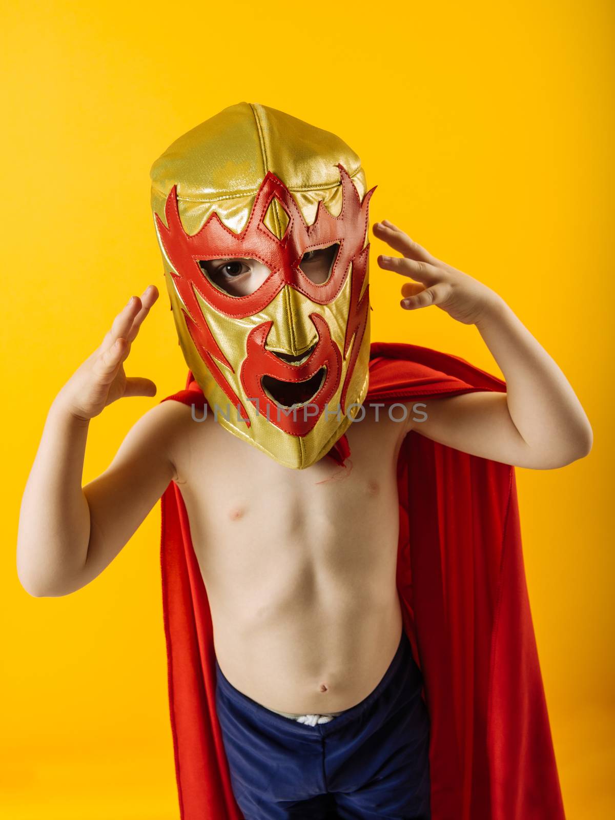 Photograph of a 4 year-old dressed as a Mexican wrestler or Luchador.
