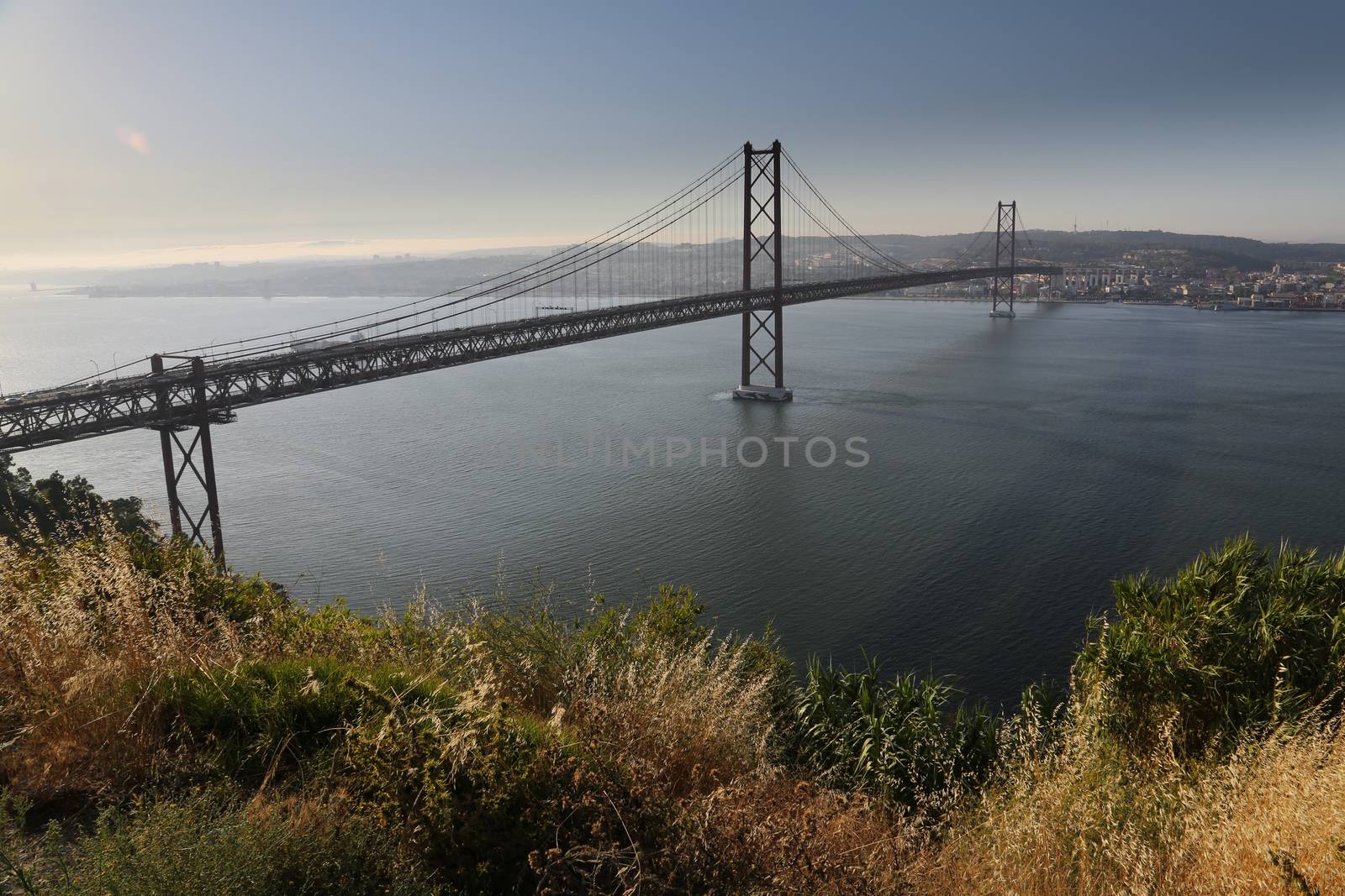 The "25 de Abril" bridge in Lisbon (Portugal) a copy of the  Golden Gate bridge.