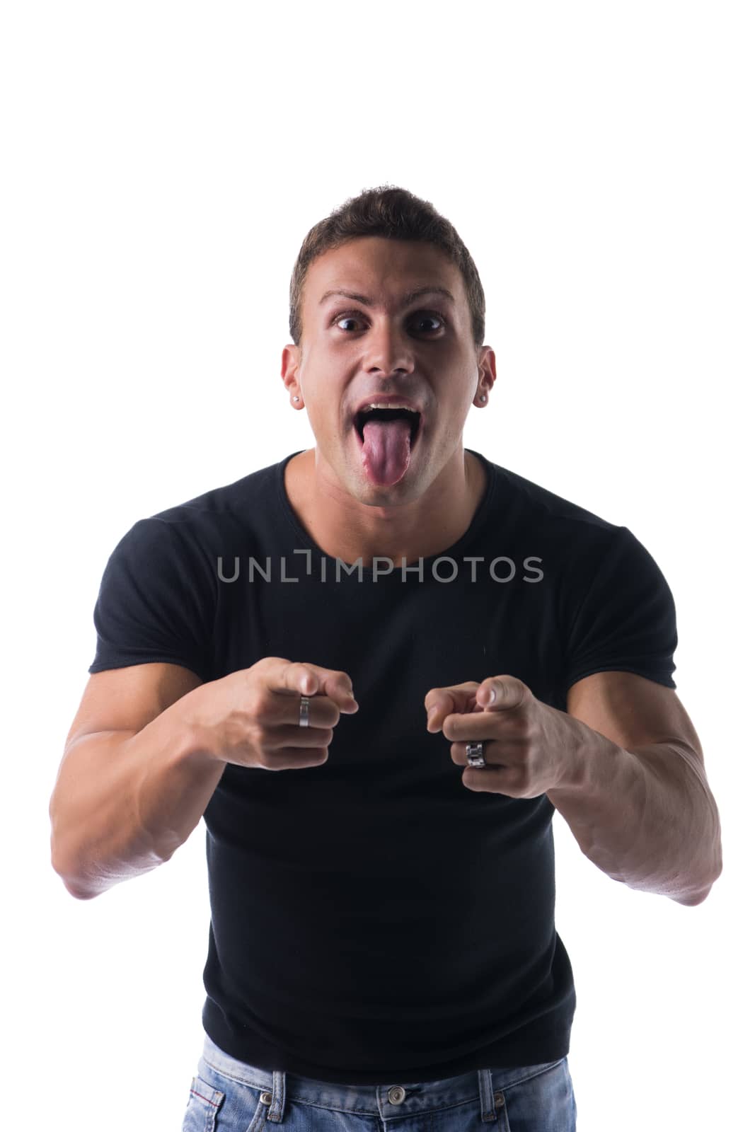 Close up Athletic Man in Black Shirt Showing Funny Facial Expression with Tongue Out While Pointing at Camera, Isolated on the Camera.