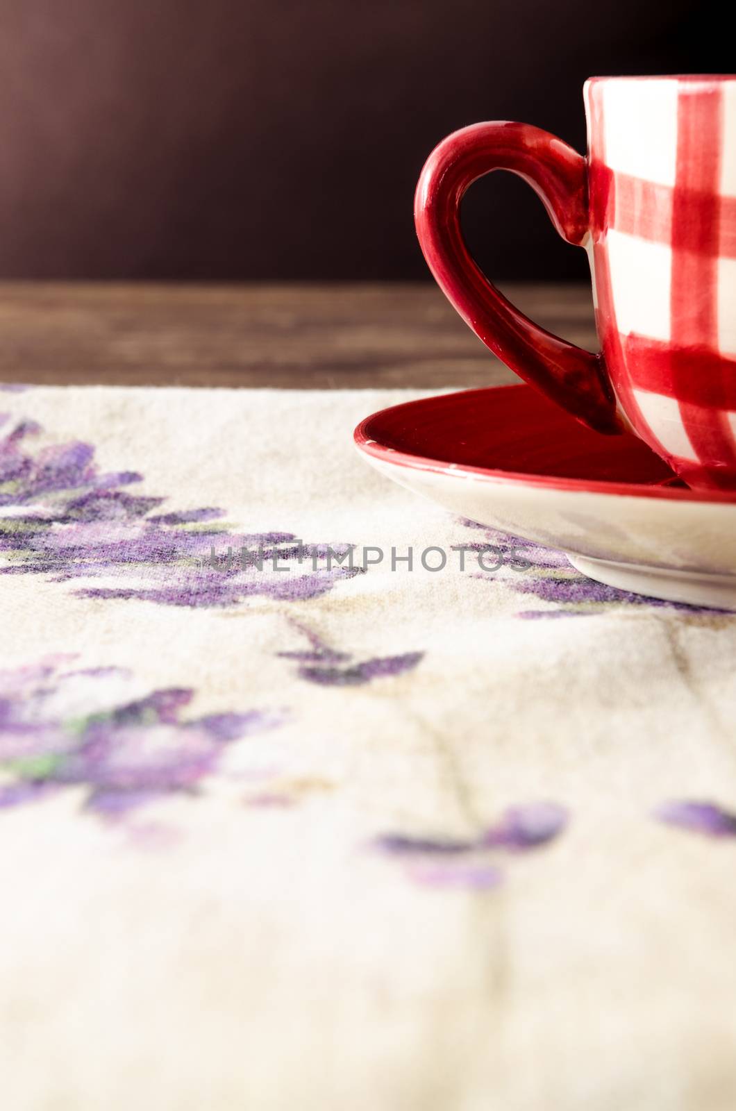 Detail of coffee cup laid on wooden vintage table by martinm303