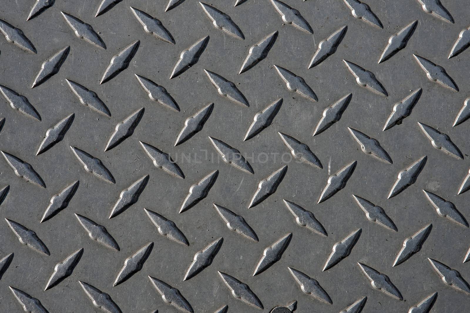 Closeup of real diamond plate metal material.