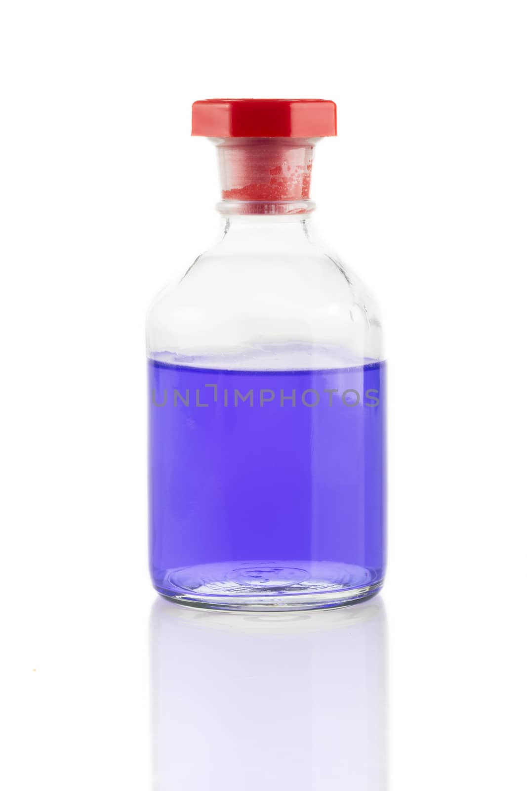 Clear glass bottle with purple liquid and red stopper.