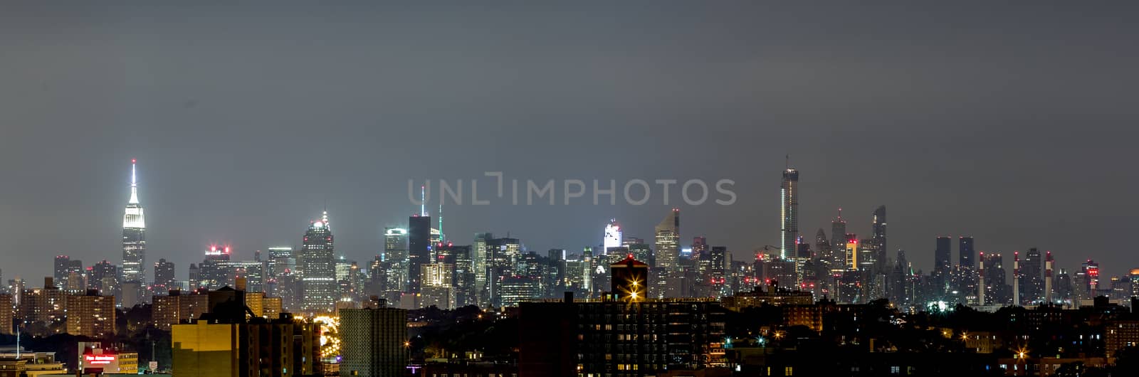 The view of Manhattan skyline at night from Queens, New York