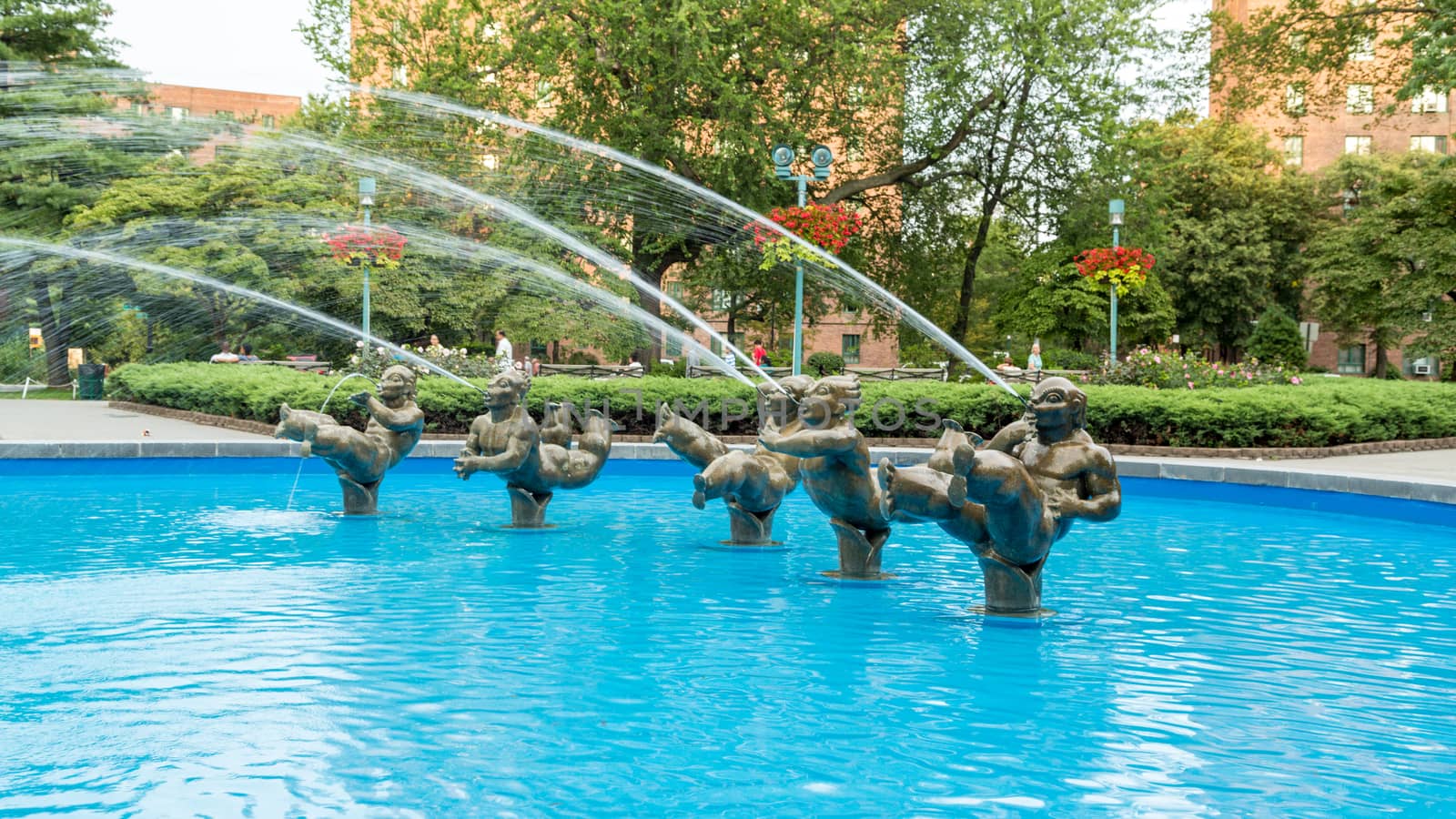 Statues spraying water at a fountain in a park located in Parkchester neighbourhood of Bronk, New York