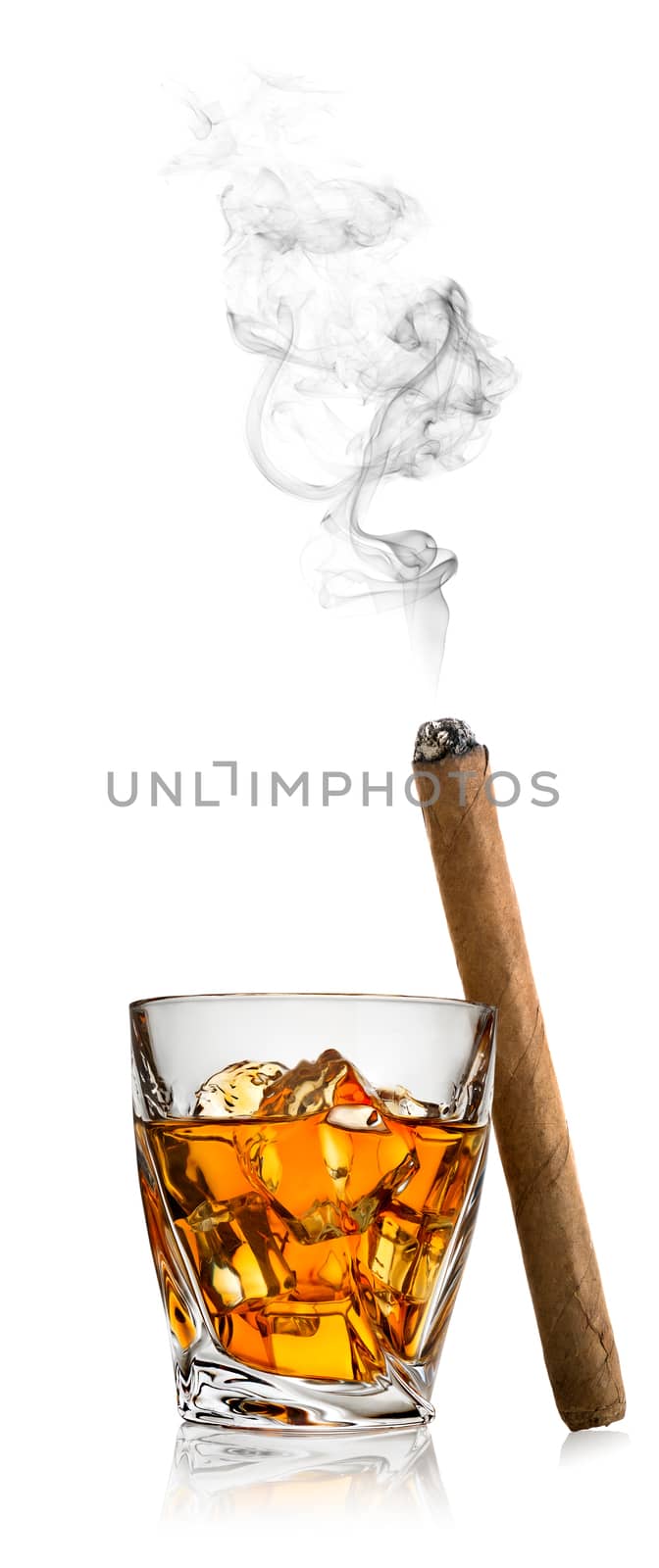 Whiskey with ice and cigar isolated on a white background