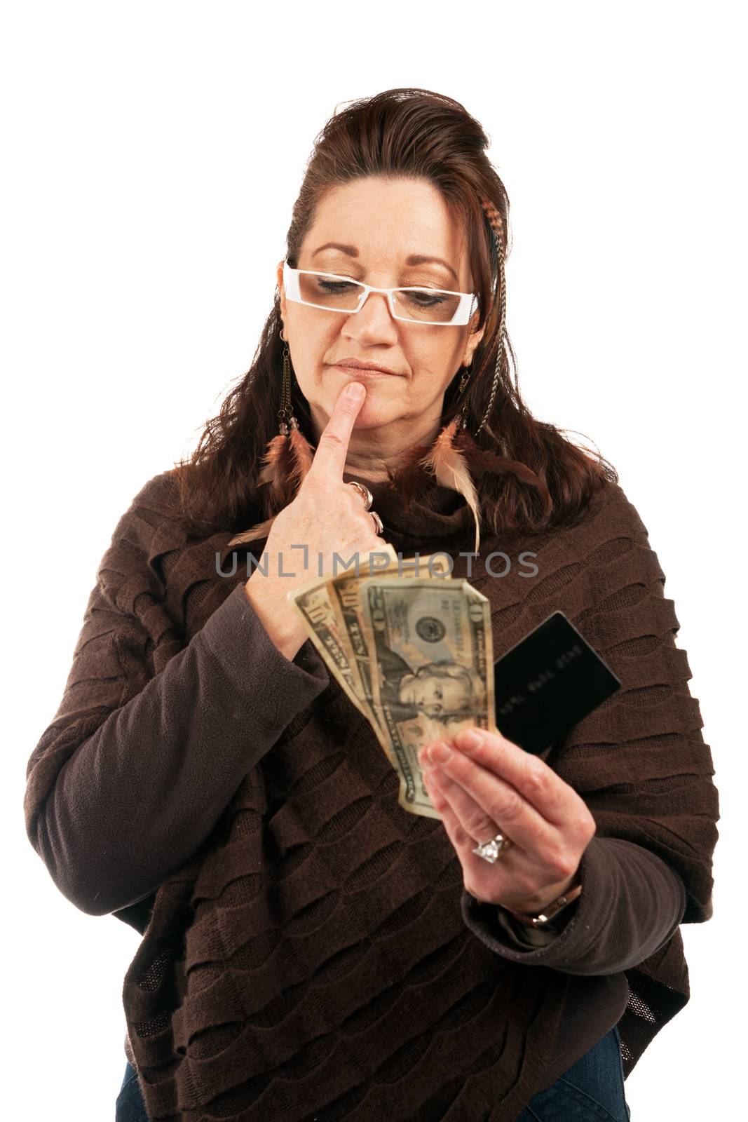 Middle aged woman holding up a blank credit card business card shoppers club card or gift card along with some cash in her other hand.