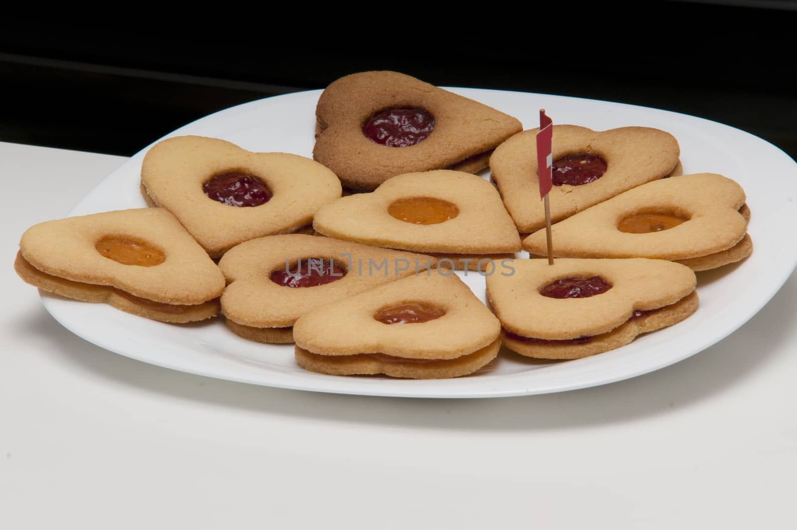 presentation of some round cookies and other heart-shaped