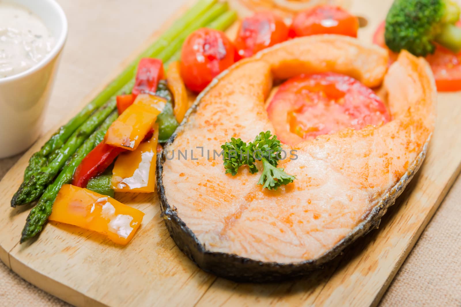 Salmon steak grilled with vegetable and Sour Cream Sauce