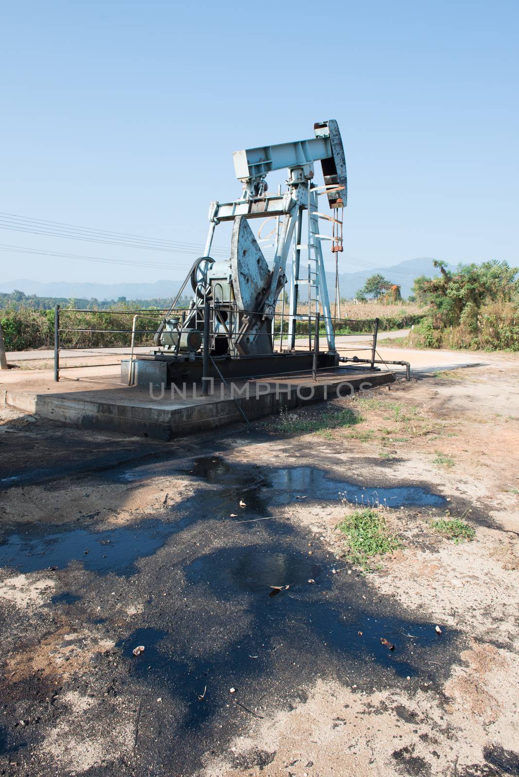 pump jack with crude oil contamination by anankkml