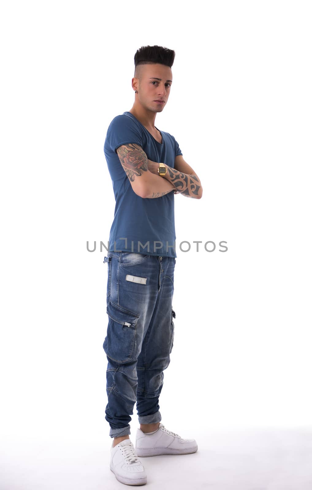 Trendy young man standing on white background by artofphoto